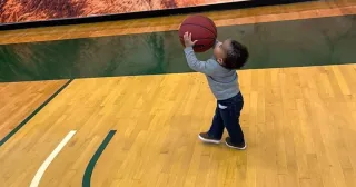 image of Aiden on Saint Leo University’s basketball court
